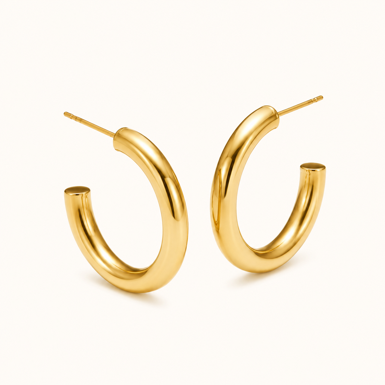 Gold hoop earrings on a white background